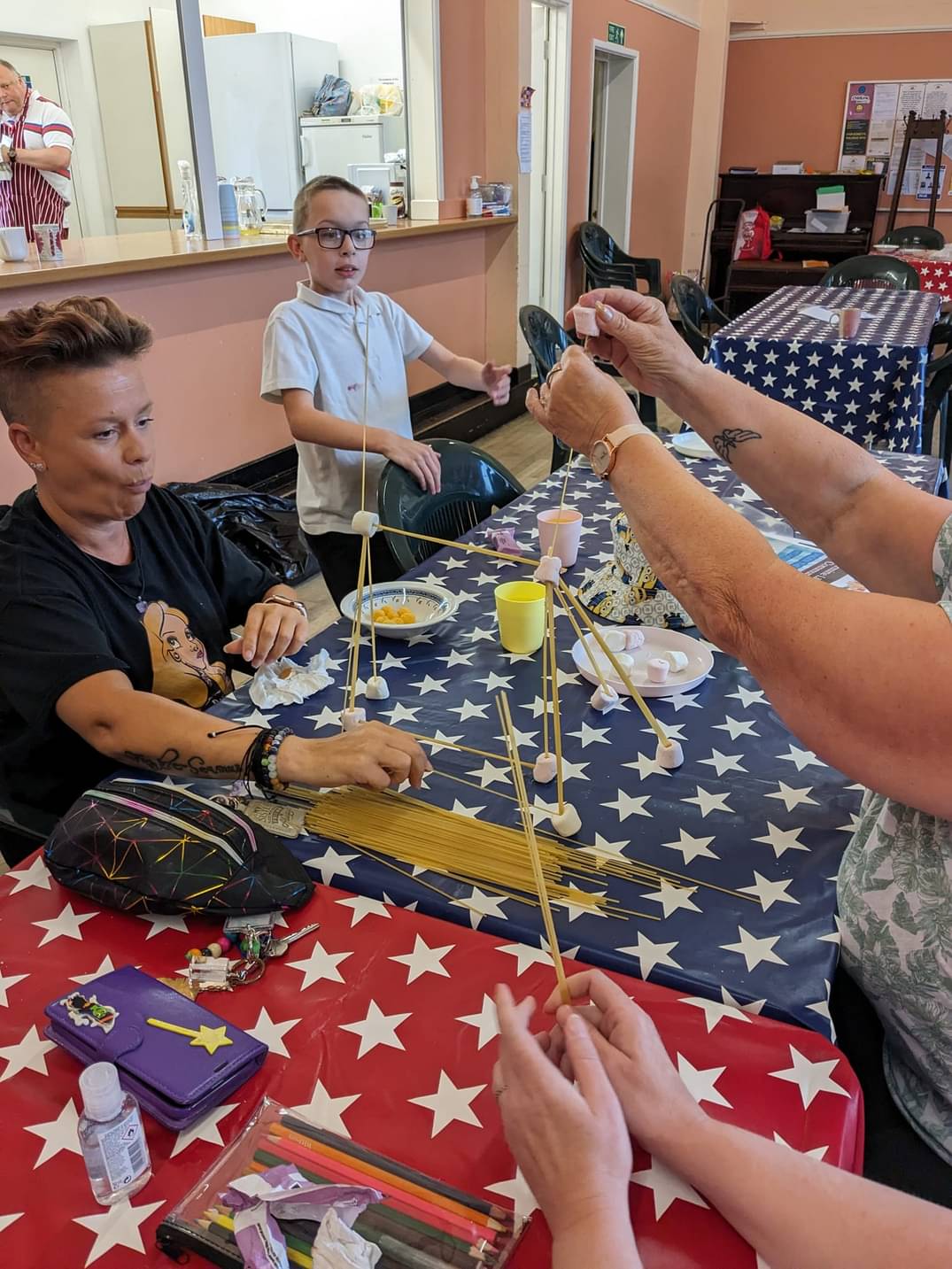 Family Challenge at Free Tea Friday, making spaghetti structures.